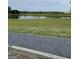 Scenic view of a tranquil pond with lush green surroundings, enhancing the property's serene ambiance at 130 Glasgow Ln, Fayetteville, GA 30214