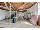 Unfinished basement with concrete floors and exposed ceiling offers plenty of room for storage at 1848 Winthrop Se Dr, Atlanta, GA 30316