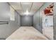 Unfinished basement shows concrete floors, painted cinder block, and potential for storage and personalization at 1848 Winthrop Se Dr, Atlanta, GA 30316