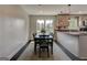 Dining room with a dark wood table, chairs, and a view into the kitchen with granite countertops at 1848 Winthrop Se Dr, Atlanta, GA 30316
