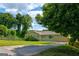 Charming home with a well-maintained lawn, mature trees, and a paved driveway at 1848 Winthrop Se Dr, Atlanta, GA 30316