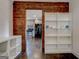 Hallway showing bookshelf and opening leading to kitchen at 1848 Winthrop Se Dr, Atlanta, GA 30316