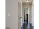 Hallway showing dark hardwood floors and access to multiple rooms at 1848 Winthrop Se Dr, Atlanta, GA 30316