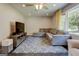 Cozy living room with a sectional sofa, area rug, and a large window providing plenty of natural light at 1848 Winthrop Se Dr, Atlanta, GA 30316