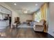 Bright living room featuring hardwood floors, a plush sectional, and large windows with stylish yellow curtains at 1848 Winthrop Se Dr, Atlanta, GA 30316