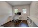Bright office space with white brick wall and hardwood floors at 1848 Winthrop Se Dr, Atlanta, GA 30316