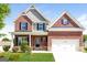 Charming two-story brick home with a well-manicured lawn and a two-car garage at 335 Autumn Bluff Dr, Lawrenceville, GA 30044