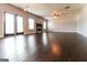 Spacious living room with a fireplace, ceiling fan, and dark hardwood floors at 335 Autumn Bluff Dr, Lawrenceville, GA 30044