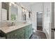 Elegant bathroom with double vanity, marble countertops, and a separate tub and closet at 905 Creekmore Ln, Loganville, GA 30052