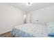 Bedroom features a comfortable queen-sized bed, wood floor, and closet creating a relaxing and inviting space at 905 Creekmore Ln, Loganville, GA 30052