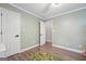 Bedroom features a door, window, wood floor and playful decor providing a comfortable and stylish space at 905 Creekmore Ln, Loganville, GA 30052