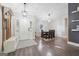 Inviting foyer with hardwood floors and a dining area featuring modern lighting fixtures at 905 Creekmore Ln, Loganville, GA 30052