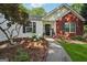 Close-up of a welcoming front entrance with a decorative wreath and flower boxes at 905 Creekmore Ln, Loganville, GA 30052