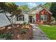 Front entrance with a decorative wreath and garden at 905 Creekmore Ln, Loganville, GA 30052