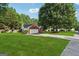 Ranch style home with a well-maintained lawn and a long driveway leading to an attached garage at 905 Creekmore Ln, Loganville, GA 30052
