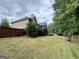 The large backyard is enhanced by the presence of mature trees and secure fencing, offering privacy and space at 237 Shockley Way, Dallas, GA 30157