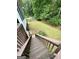 A well-maintained, large backyard features a dog house and stairs leading down from the deck at 237 Shockley Way, Dallas, GA 30157
