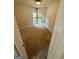 Cozy bedroom features plush carpeting, a double-window and neutral paint at 237 Shockley Way, Dallas, GA 30157