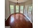The breakfast nook features wood floors, with windows and door leading to outdoor patio at 237 Shockley Way, Dallas, GA 30157