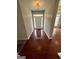 A spacious foyer features hardwood floors and a white front door with sidelights at 237 Shockley Way, Dallas, GA 30157