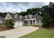 Charming home with manicured lawn, inviting entrance, and attached two-car garage for convenient living at 237 Shockley Way, Dallas, GA 30157