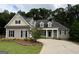 Charming home with manicured lawn, inviting entrance, and beautiful landscaping, offering great curb appeal at 237 Shockley Way, Dallas, GA 30157