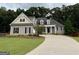 Charming home with manicured lawn, inviting entrance, and beautiful landscaping, offering great curb appeal at 237 Shockley Way, Dallas, GA 30157