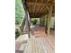 A covered hot tub sits on a wooden deck with stairs leading to the yard at 237 Shockley Way, Dallas, GA 30157