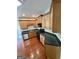 A functional kitchen with black countertops, wood cabinets and stainless steel appliances at 237 Shockley Way, Dallas, GA 30157