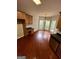 Eat-in kitchen features wood floors, countertops, and backsplash near the windowed breakfast nook at 237 Shockley Way, Dallas, GA 30157
