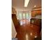 Eat-in kitchen features wood floors, countertops, and backsplash near the windowed breakfast nook at 237 Shockley Way, Dallas, GA 30157