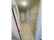 Functional laundry room with tiled floors, utility sink, and shelving at 237 Shockley Way, Dallas, GA 30157