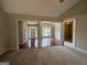 A spacious living room shows hardwood and carpet floors divided by decorative pillars at 237 Shockley Way, Dallas, GA 30157