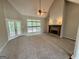 An inviting living room with a stone fireplace, ceiling fan and access to a deck at 237 Shockley Way, Dallas, GA 30157