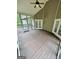 Charming screened porch featuring a vaulted ceiling and direct access to the outdoors through double doors at 237 Shockley Way, Dallas, GA 30157