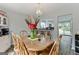 Cozy dining room featuring an adjacent breakfast bar and exterior views at 4180 Pineset Dr, Alpharetta, GA 30022