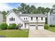 Charming two-story home with a well-manicured lawn, two-car garage, and a basketball hoop above the garage at 4180 Pineset Dr, Alpharetta, GA 30022