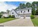 Charming two-story home featuring a two-car garage, landscaped yard, and a basketball hoop in the driveway at 4180 Pineset Dr, Alpharetta, GA 30022