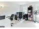 Home office setup with two desks, chairs, computer monitors, and a bookcase at 4180 Pineset Dr, Alpharetta, GA 30022