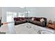 Inviting living room featuring a large sectional sofa and ample natural light at 4180 Pineset Dr, Alpharetta, GA 30022