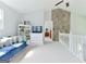 Spacious loft area featuring a stone accent wall and comfortable seating at 4180 Pineset Dr, Alpharetta, GA 30022