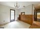 Bright dining area featuring chandelier and access to the adjacent hallway at 400 Mccart Rd, Mcdonough, GA 30252