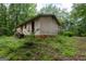 Side and back exterior of property, showing yard and mature trees at 400 Mccart Rd, Mcdonough, GA 30252