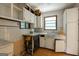 Kitchen featuring white cabinets, a window and views of the sink at 400 Mccart Rd, Mcdonough, GA 30252