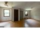 Open living space featuring wood floors and views of multiple windows at 400 Mccart Rd, Mcdonough, GA 30252