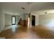 Open floorplan with wood floors, light walls and natural light from windows at 400 Mccart Rd, Mcdonough, GA 30252