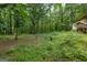 View of the side of the property, surrounded by woods at 400 Mccart Rd, Mcdonough, GA 30252