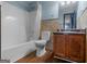 Full bathroom with a shower-tub combo, light blue paint, and a wooden vanity at 424 Browning Field Way, Hampton, GA 30228