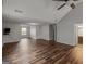 Large living room with vaulted ceilings, hardwood floors, and natural light from the windows at 424 Browning Field Way, Hampton, GA 30228