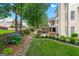 An expansive backyard featuring a patio, garden beds, and lush green lawn at 5833 Wembley Dr, Douglasville, GA 30135